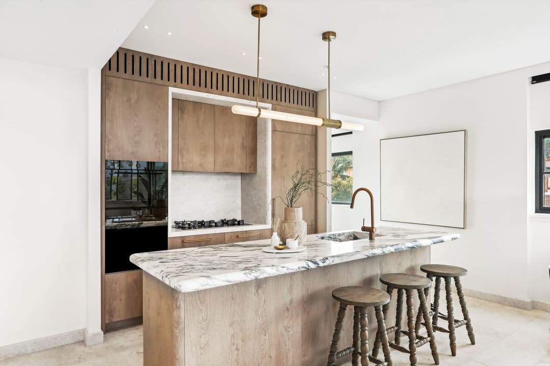 Modern kitchen with timber cabinetry and marble island