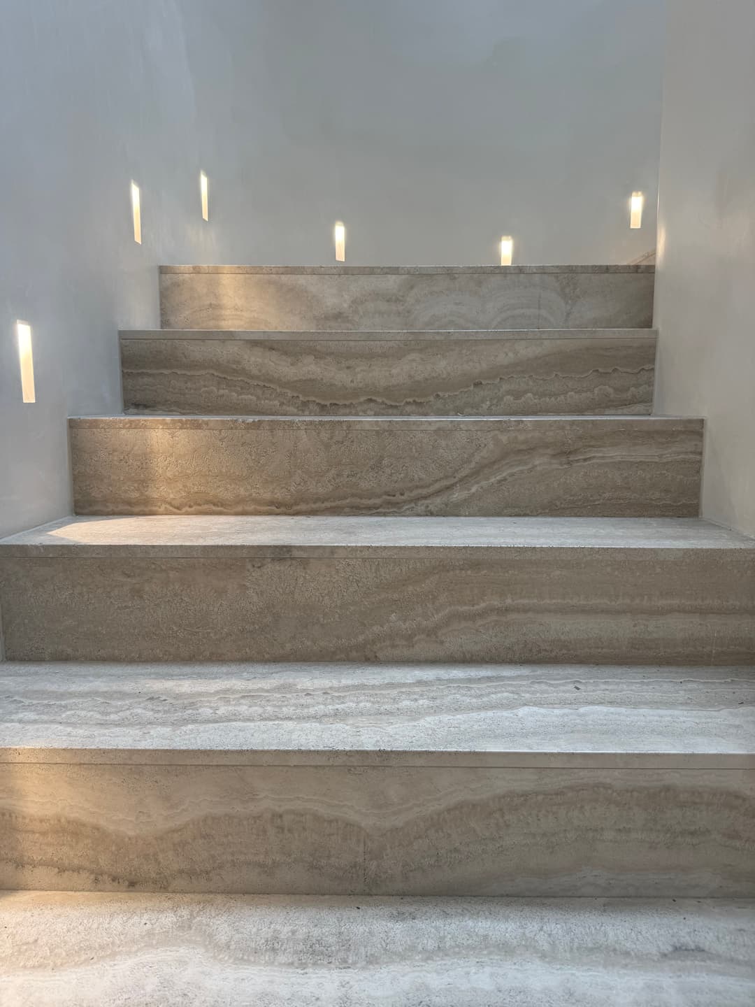 Luxury marble bathroom with professional caulking around columns in Mosman